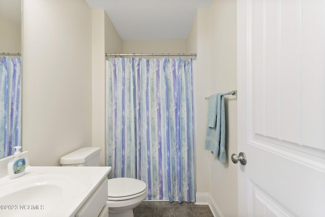 full bath featuring toilet, a shower with curtain, baseboards, tile patterned flooring, and vanity