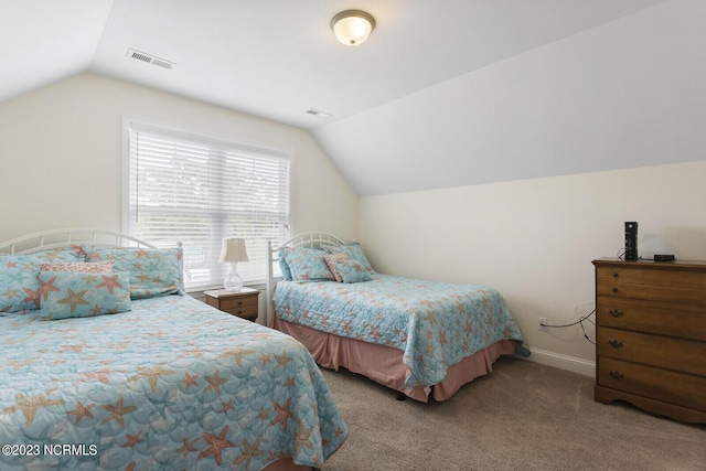 carpeted bedroom with lofted ceiling, baseboards, and visible vents