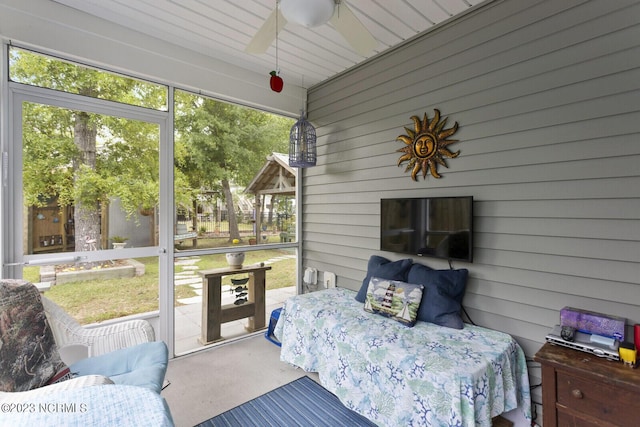 sunroom / solarium featuring a ceiling fan and a healthy amount of sunlight