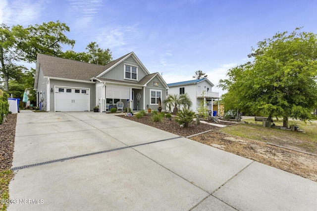 craftsman house with covered porch, a garage, and driveway