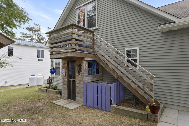 back of property with stairs