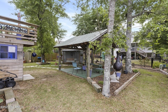 view of yard with a gazebo and fence