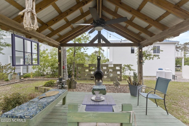 exterior space featuring ceiling fan, a wooden deck, and a gazebo