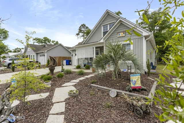view of front of property featuring concrete driveway, an attached garage, and board and batten siding