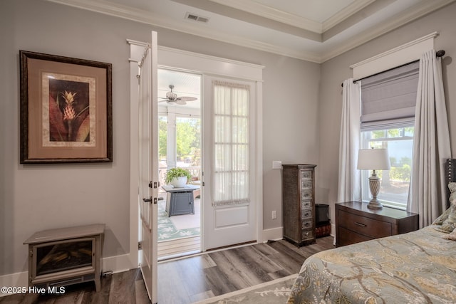9298 W Lake Rd, Calabash, NC 28467 - bedroom featuring ornamental molding, access to outside, visible vents, and wood finished floors
