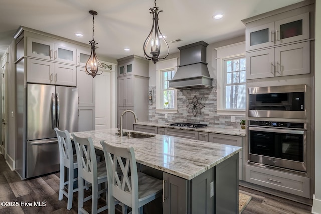 9298 W Lake Rd, Calabash, NC 28467 - kitchen with a sink, dark wood finished floors, gray cabinetry, appliances with stainless steel finishes, and premium range hood