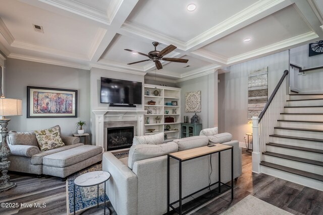 9298 W Lake Rd, Calabash, NC 28467 - living area featuring a high end fireplace, wood finished floors, ornamental molding, stairway, and ceiling fan