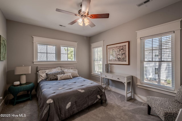 9298 W Lake Rd, Calabash, NC 28467 - carpeted bedroom featuring visible vents, baseboards, and a ceiling fan