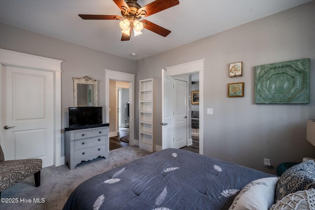 9298 W Lake Rd, Calabash, NC 28467 - bedroom with light colored carpet and a ceiling fan