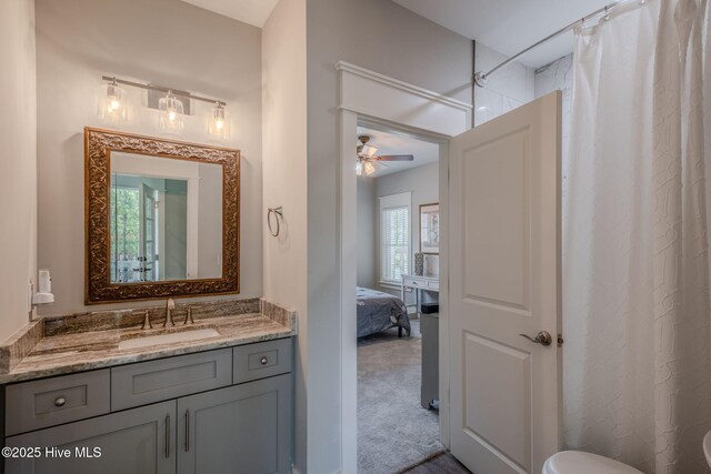 9298 W Lake Rd, Calabash, NC 28467 - full bathroom with toilet, vanity, ceiling fan, and a shower with shower curtain