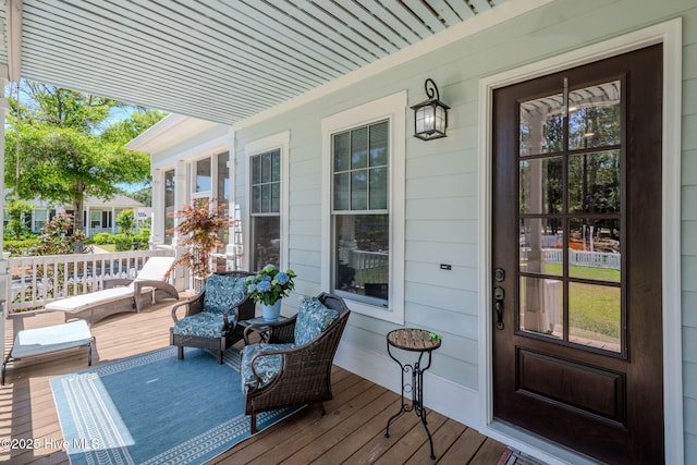 9298 W Lake Rd, Calabash, NC 28467 - wooden deck featuring a porch
