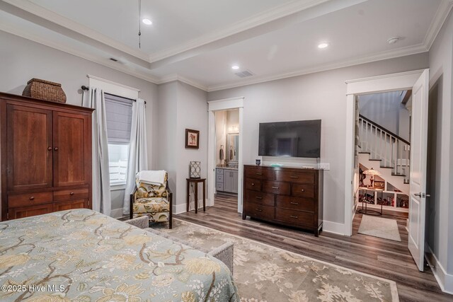 9298 W Lake Rd, Calabash, NC 28467 - bedroom with recessed lighting, baseboards, ornamental molding, visible vents, and wood finished floors