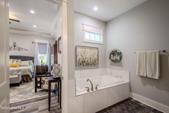 9298 W Lake Rd, Calabash, NC 28467 - ensuite bathroom with recessed lighting, ensuite bath, a bath, crown molding, and wood finished floors
