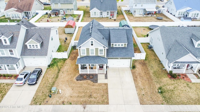 birds eye view of property with a residential view
