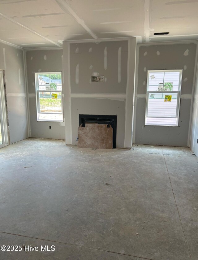 506 Grassy Gap Trl Unit 70, Aberdeen, NC 28315 - unfurnished living room with a fireplace