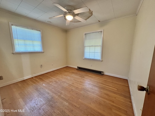 empty room with ornamental molding, baseboards, ceiling fan, a baseboard radiator, and light wood finished floors