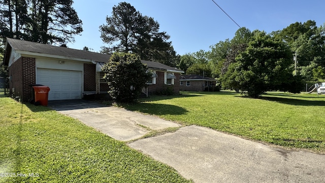 view of front of house with a garage, concrete driveway, a front yard, and brick siding