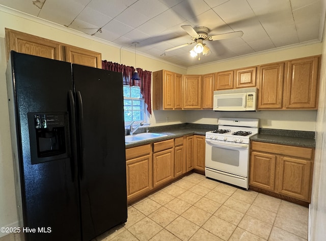 kitchen with ceiling fan, dark countertops, a sink, light tile patterned floors, and white appliances