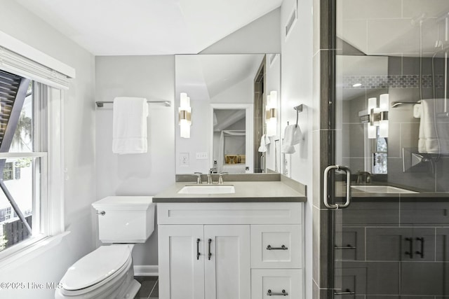 6412 Westport Dr, Wilmington, NC 28409 - bathroom featuring vanity, baseboards, toilet, and a shower stall