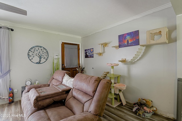 living area with wood finished floors and ornamental molding