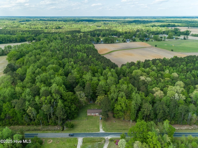 aerial view featuring a wooded view