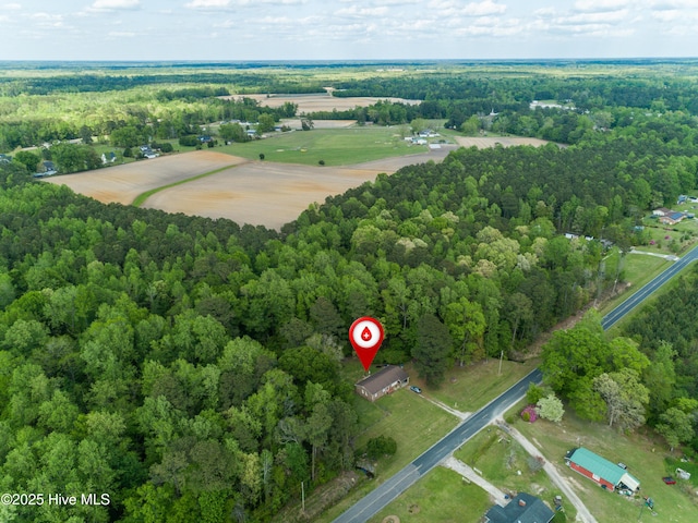 bird's eye view featuring a wooded view