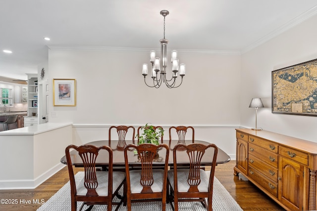 8819 Sawmill Creek Ln, Wilmington, NC 28411 - dining area with a chandelier, dark wood-style flooring, ornamental molding, recessed lighting, and baseboards