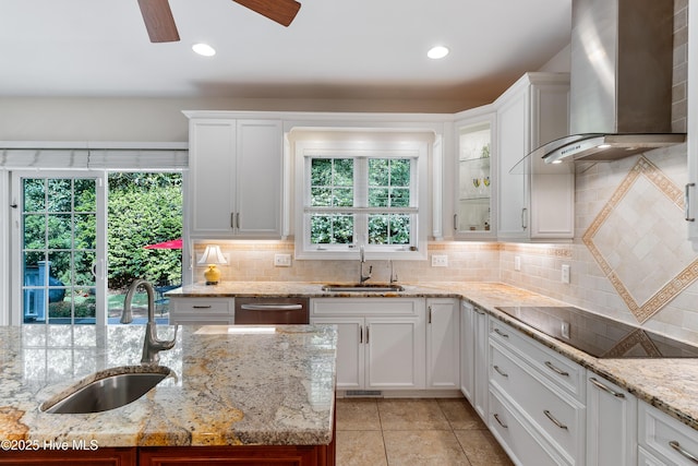 8819 Sawmill Creek Ln, Wilmington, NC 28411 - kitchen with wall chimney range hood, a sink, black electric stovetop, dishwasher, and decorative backsplash