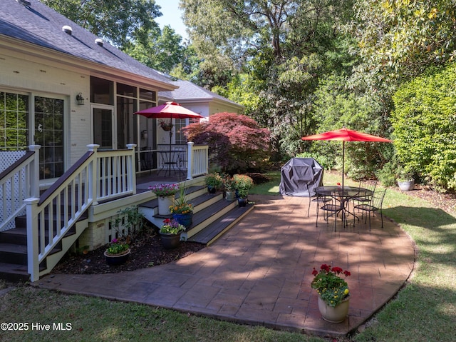 8819 Sawmill Creek Ln, Wilmington, NC 28411 - view of patio with outdoor dining space and a sunroom