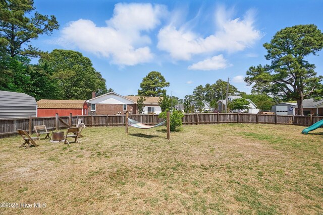 107 Magnolia Dr, Camden, NC 27921 - view of yard with a playground and an outdoor fire pit