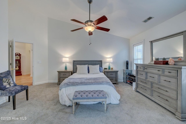 5029 Woods Edge Rd, Wilmington, NC 28409 - bedroom with light colored carpet, visible vents, baseboards, a ceiling fan, and high vaulted ceiling