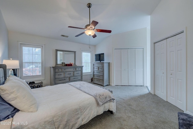 5029 Woods Edge Rd, Wilmington, NC 28409 - carpeted bedroom featuring multiple closets, ceiling fan, baseboards, visible vents, and lofted ceiling