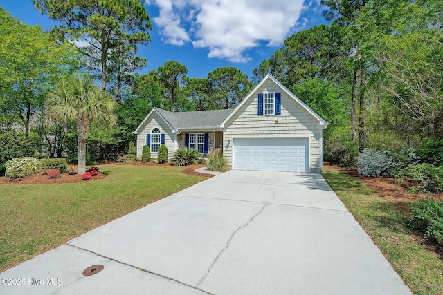 5029 Woods Edge Rd, Wilmington, NC 28409 - view of front facade with a front lawn, driveway, and an attached garage
