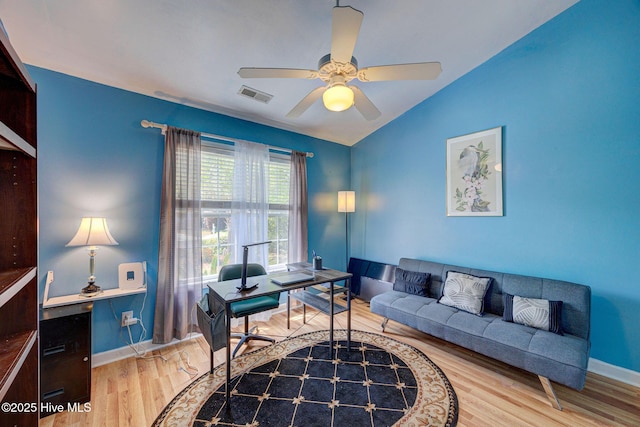 5029 Woods Edge Rd, Wilmington, NC 28409 - home office featuring visible vents, ceiling fan, baseboards, vaulted ceiling, and wood finished floors
