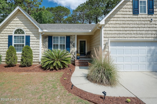 5029 Woods Edge Rd, Wilmington, NC 28409 - single story home with roof with shingles, concrete driveway, and an attached garage