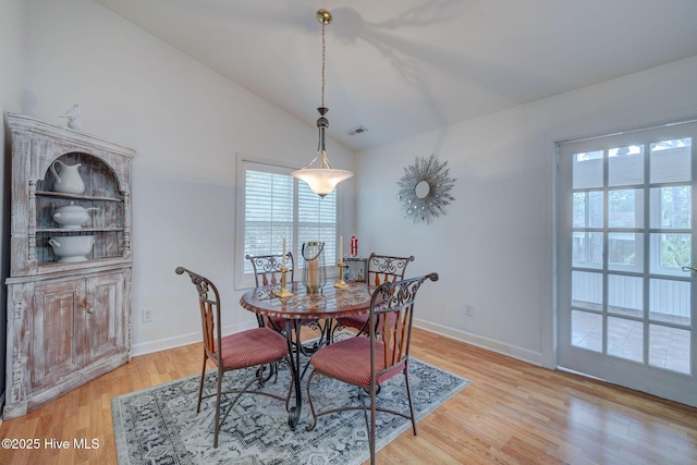 5029 Woods Edge Rd, Wilmington, NC 28409 - dining area with visible vents, light wood-type flooring, a healthy amount of sunlight, and lofted ceiling