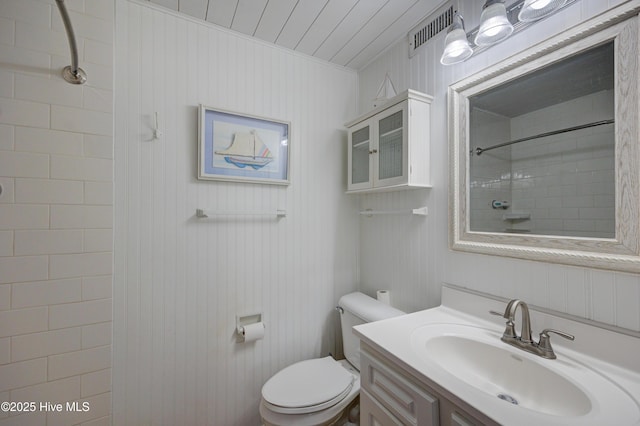 full bathroom featuring visible vents, walk in shower, toilet, and vanity
