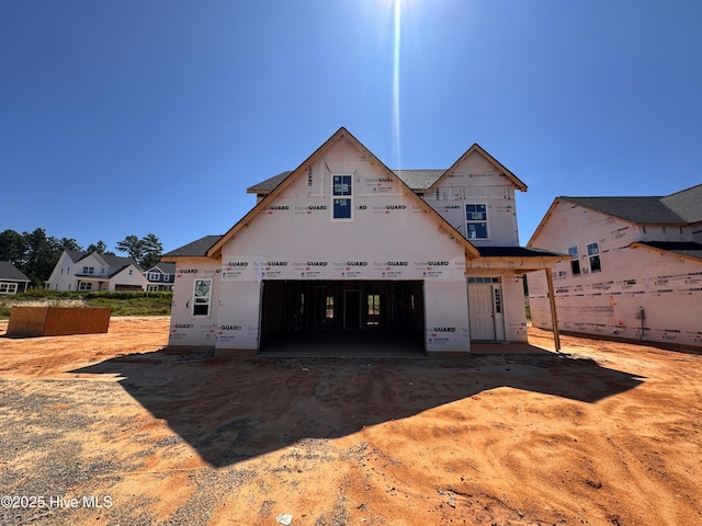 518 Grassy Gap Trl Unit 68, Aberdeen, NC 28315 - view of front of property with a garage and dirt driveway