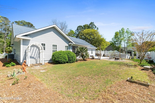 1870 Harbor Dr SW, Ocean Isle Beach, NC 28469 - exterior space with central air condition unit, a patio, fence, and a lawn