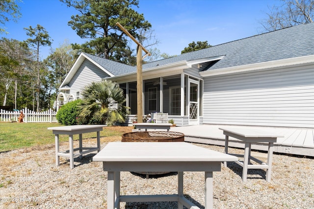 1870 Harbor Dr SW, Ocean Isle Beach, NC 28469 - view of patio / terrace featuring a sunroom and fence