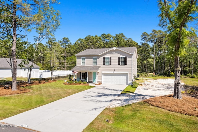 4333 Jones St SW, Shallotte, NC 28470 - traditional-style home featuring concrete driveway, covered porch, an attached garage, fence, and a front yard
