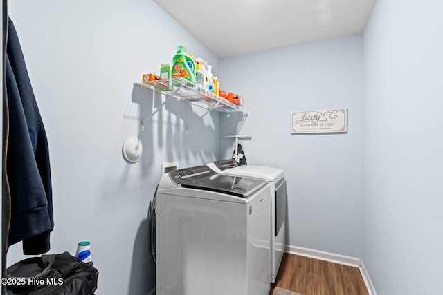 4333 Jones St SW, Shallotte, NC 28470 - laundry area featuring baseboards, dark wood-type flooring, washer and clothes dryer, and laundry area
