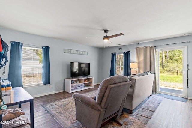 4333 Jones St SW, Shallotte, NC 28470 - living room featuring baseboards, wood finished floors, a wealth of natural light, and ceiling fan