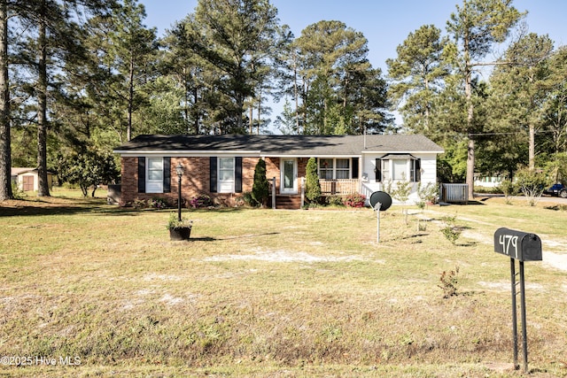 479 W 5th St, Garland, NC 28441 - ranch-style home featuring central air condition unit, a shed, a front yard, and an outdoor structure