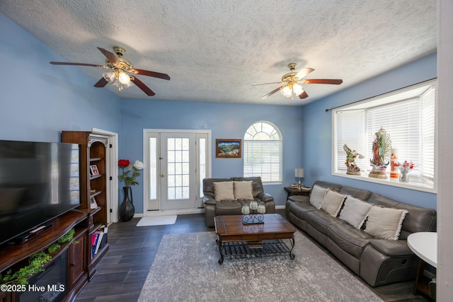 479 W 5th St, Garland, NC 28441 - living area featuring baseboards, a textured ceiling, wood finished floors, and ceiling fan