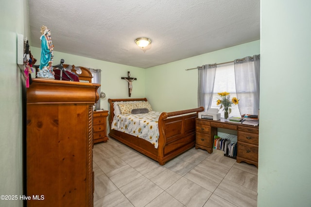 479 W 5th St, Garland, NC 28441 - bedroom featuring light tile patterned floors and a textured ceiling