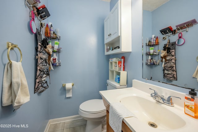 479 W 5th St, Garland, NC 28441 - bathroom with tile patterned flooring, vanity, baseboards, and toilet