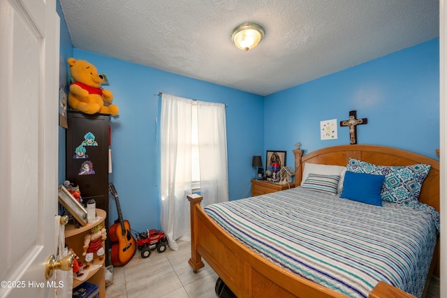 479 W 5th St, Garland, NC 28441 - bedroom with light tile patterned flooring and a textured ceiling