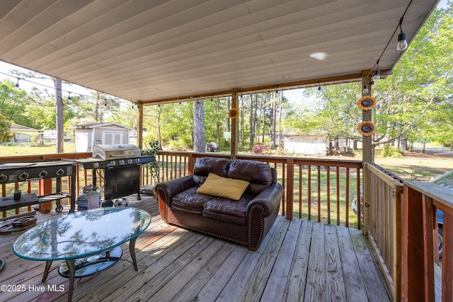 479 W 5th St, Garland, NC 28441 - deck featuring grilling area, a storage unit, and an outdoor structure