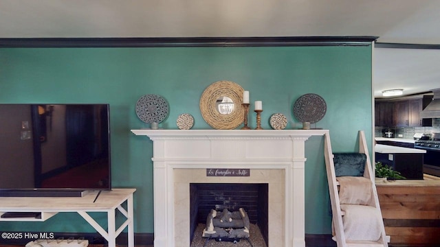 724 York St, Rocky Mount, NC 27803 - details featuring stainless steel range with gas stovetop, backsplash, and a high end fireplace